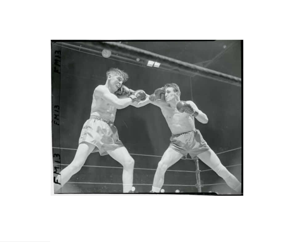 Gustav Scholz Punching The Opposition Player Background