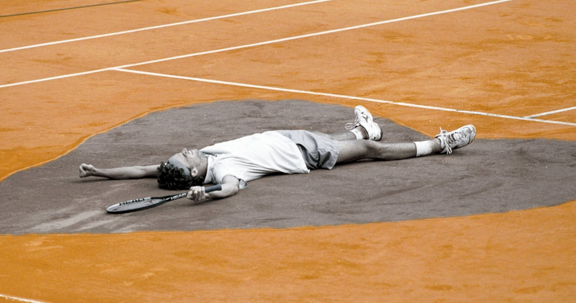 Gustavo Kuerten Flat On The Ground Background