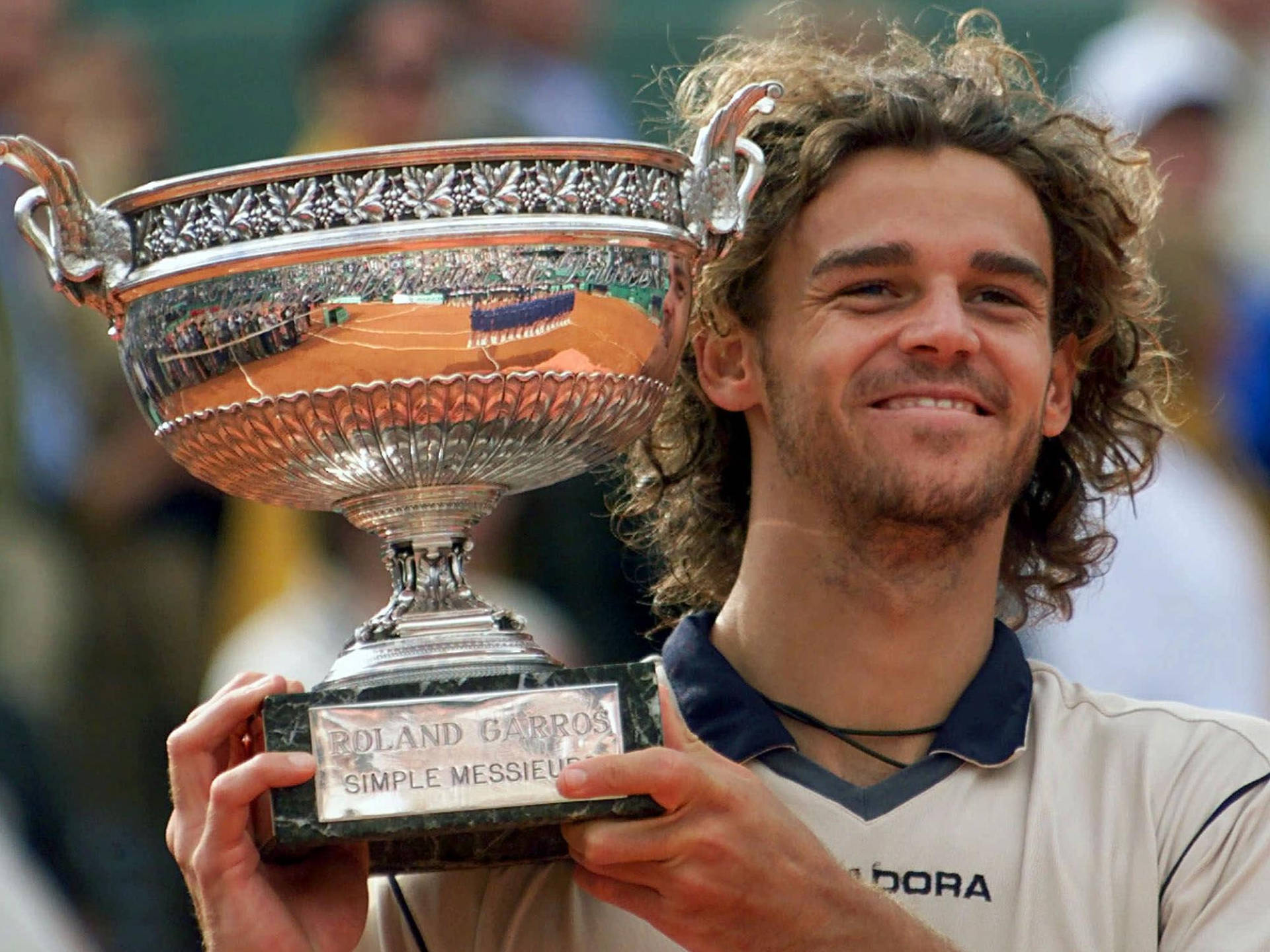 Gustavo Kuerten Holding His Trophy