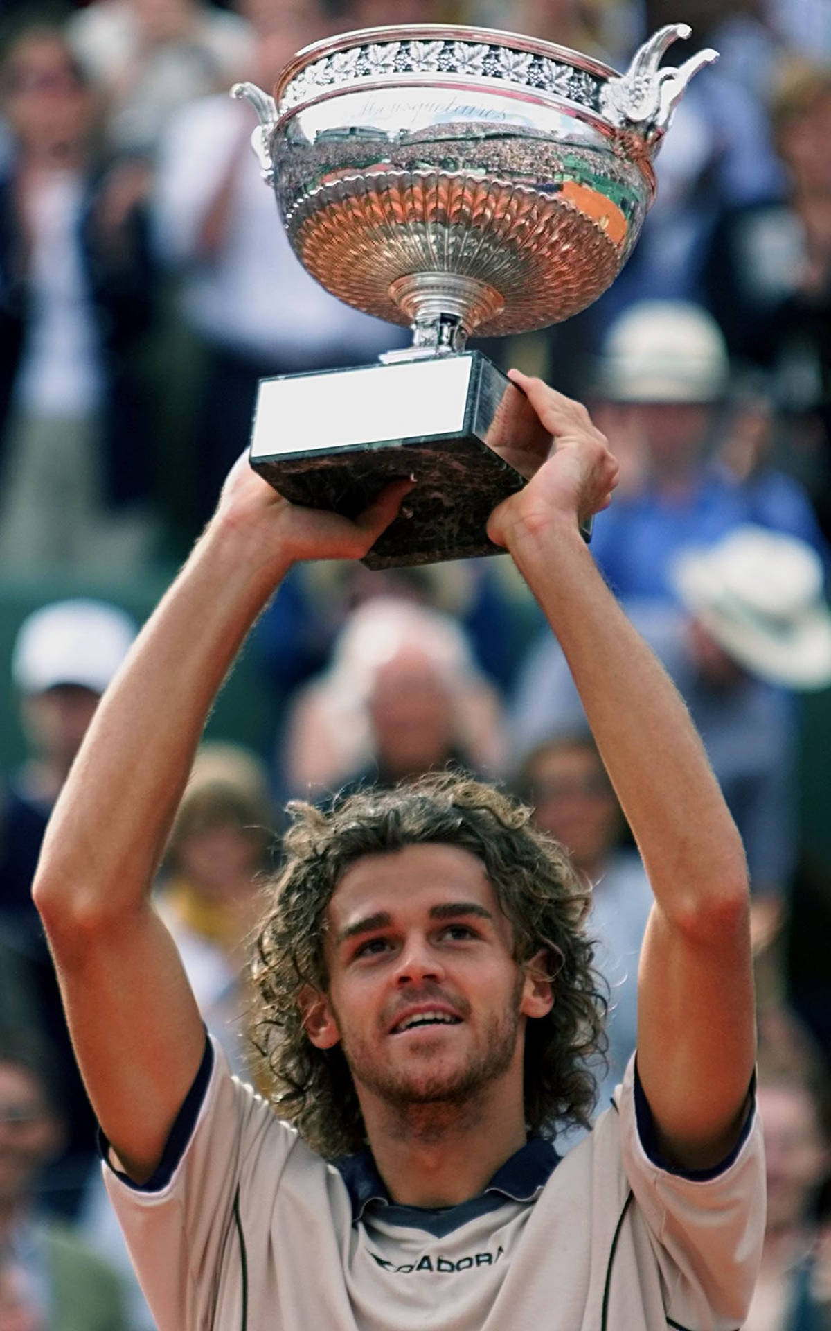 Gustavo Kuerten Holding His Trophy Up Background