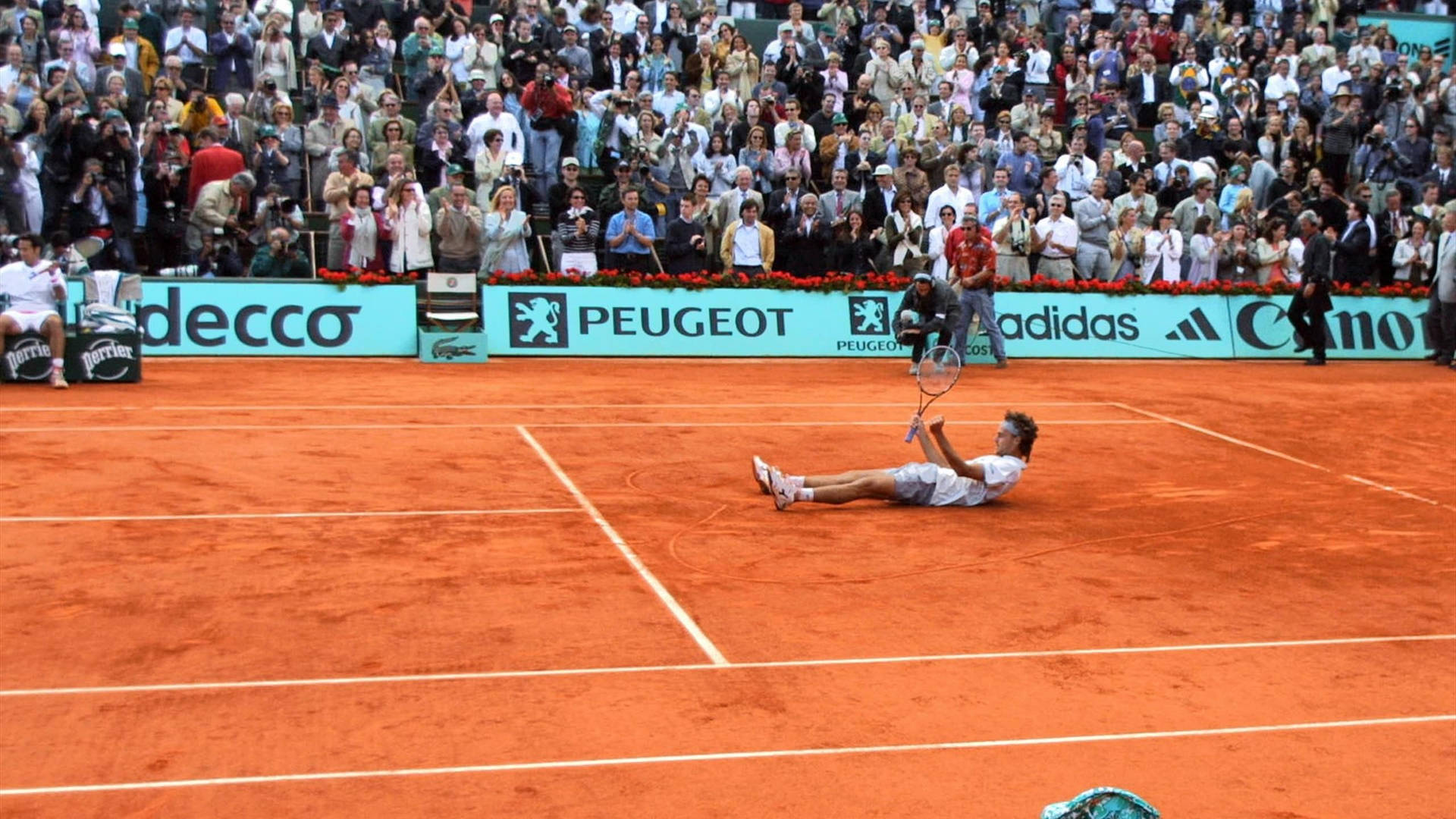 Gustavo Kuerten Lying On The Court Background