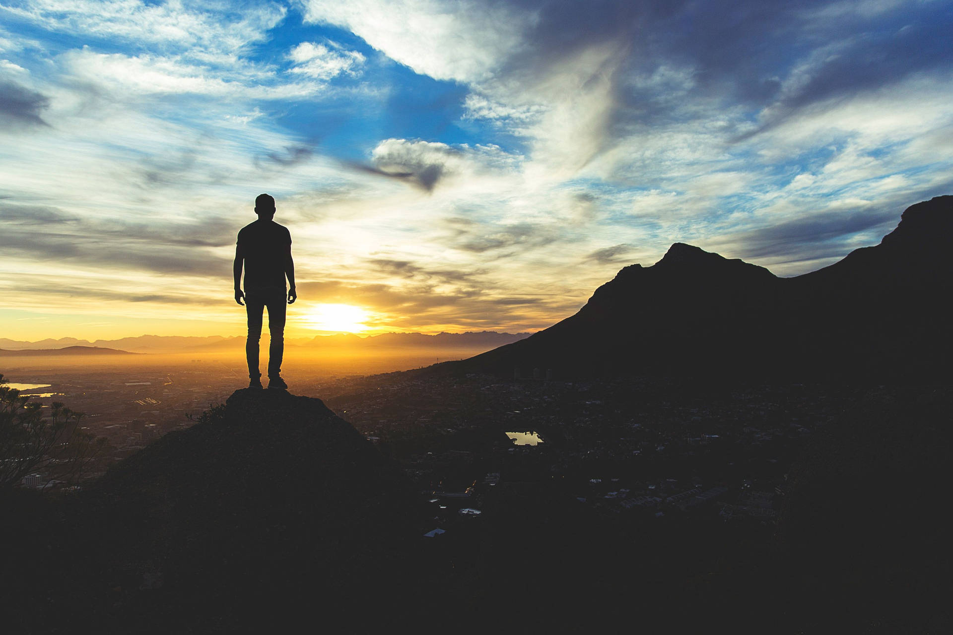 Guy Silhouette On A Hilltop At Sunrise Background