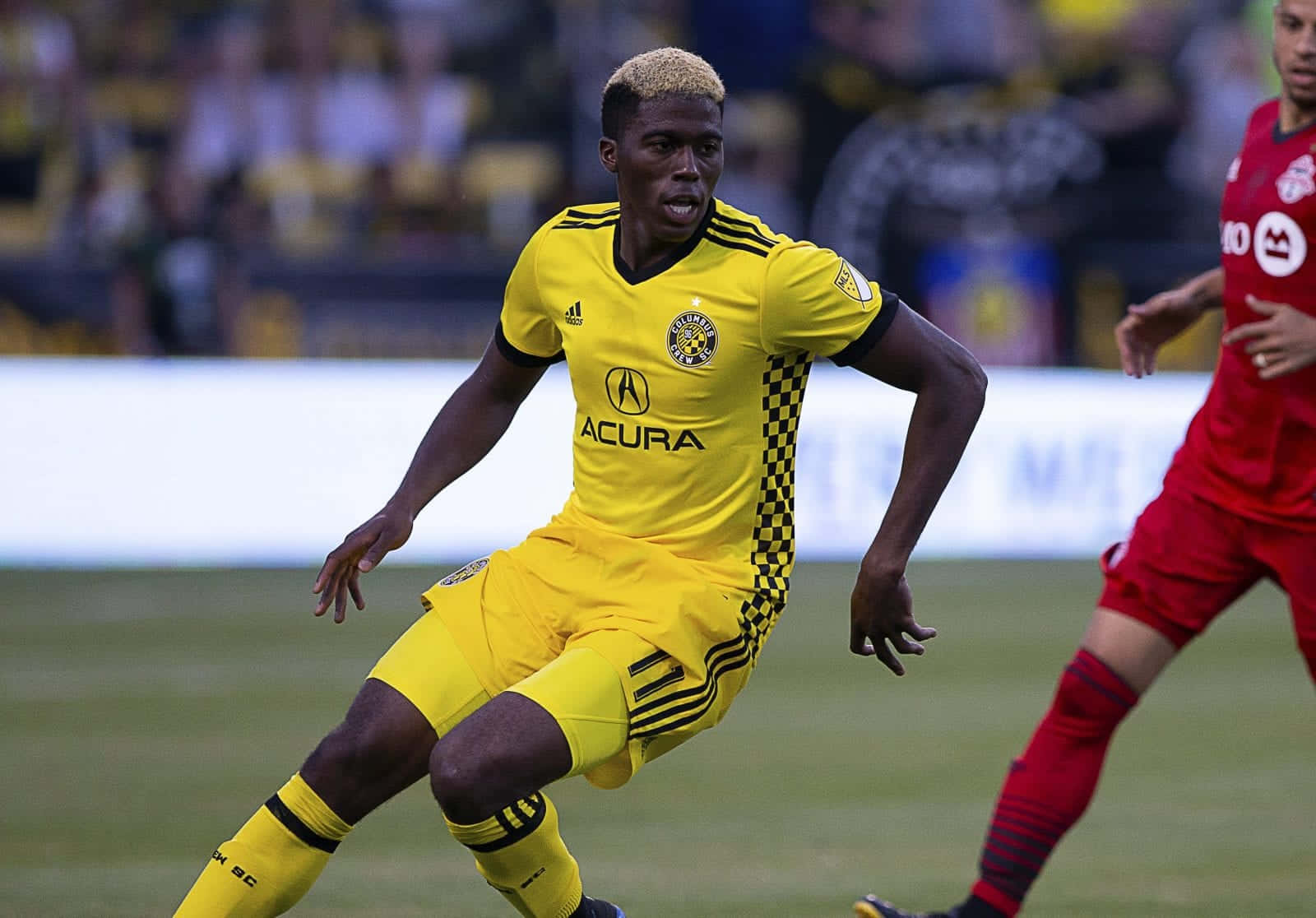 Gyasi Zardes Chases Ball With New York Red Bulls Background