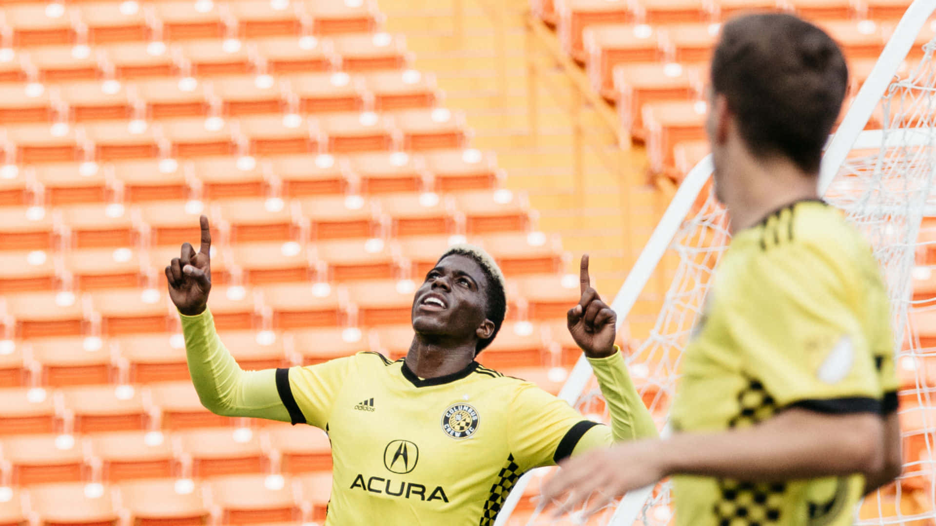 Gyasi Zardes Of Columbus Crew Points Up Background