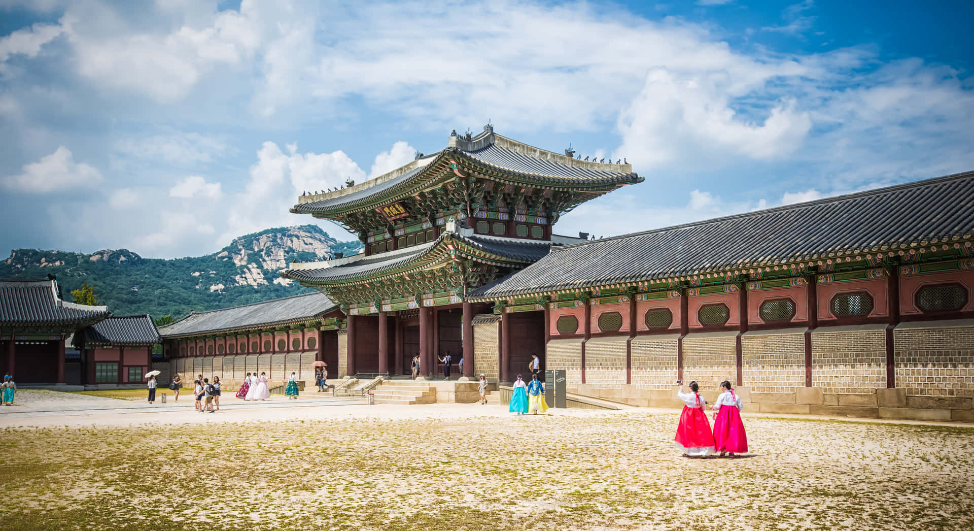 Gyeongbokgung Palace Tourists In Traditional Clothing Background
