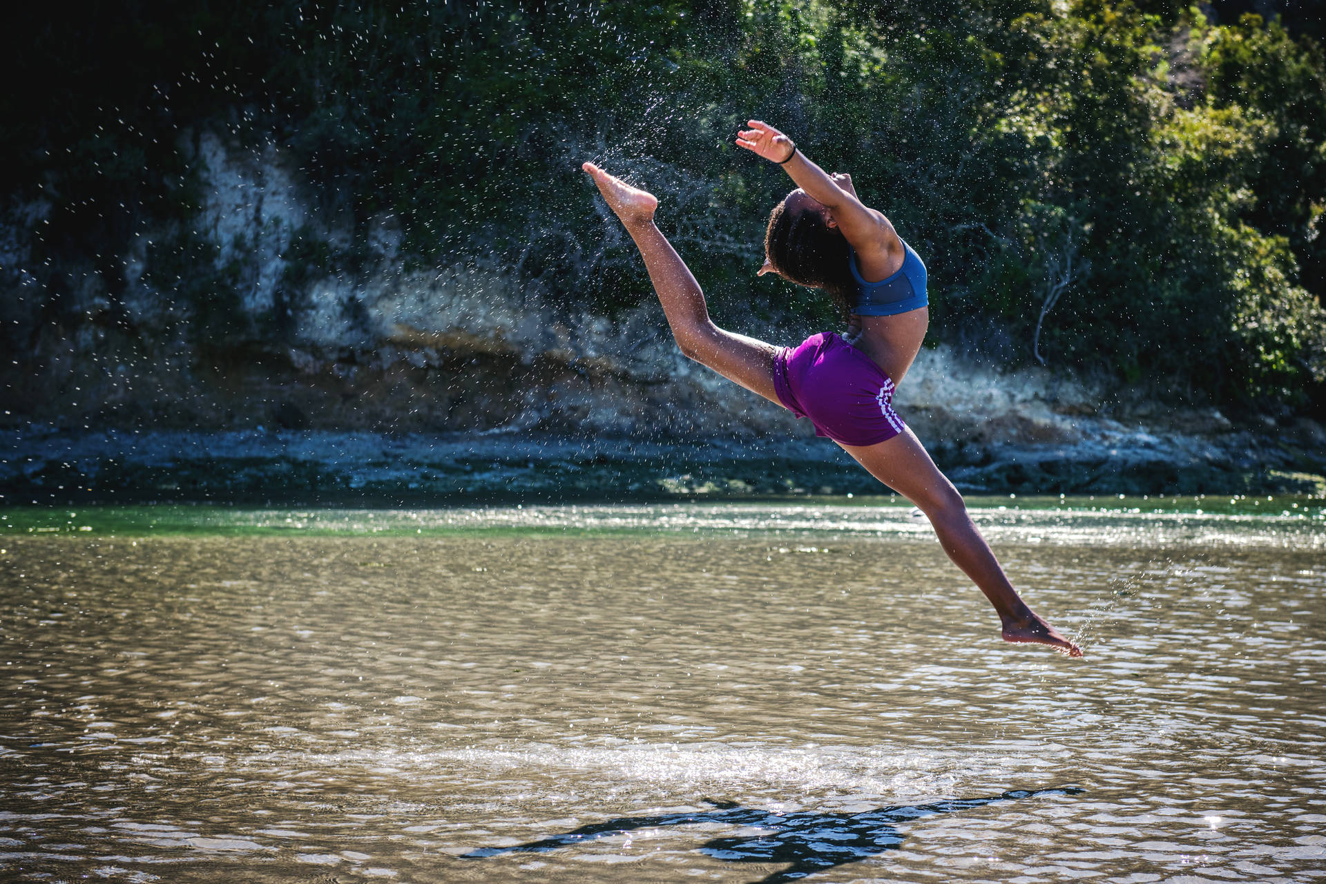 Gymnastics Jump In River Background