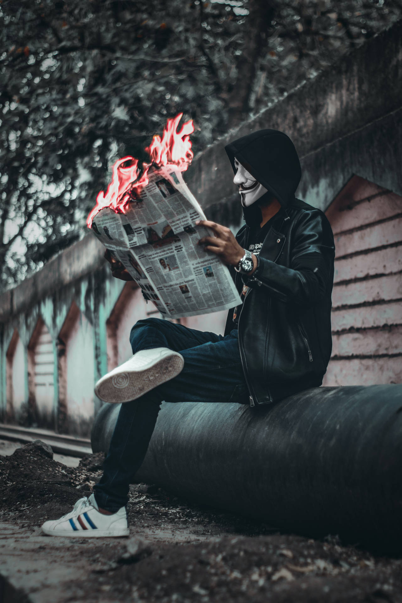 Hacker Mask Man With Newspaper Background