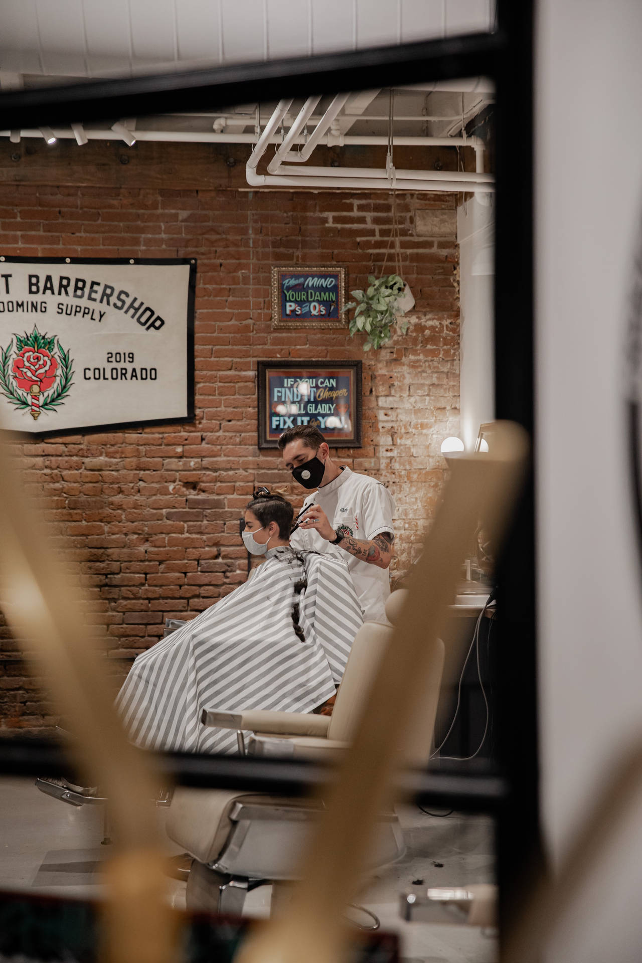 Hairdresser Performing Haircut On Client Background