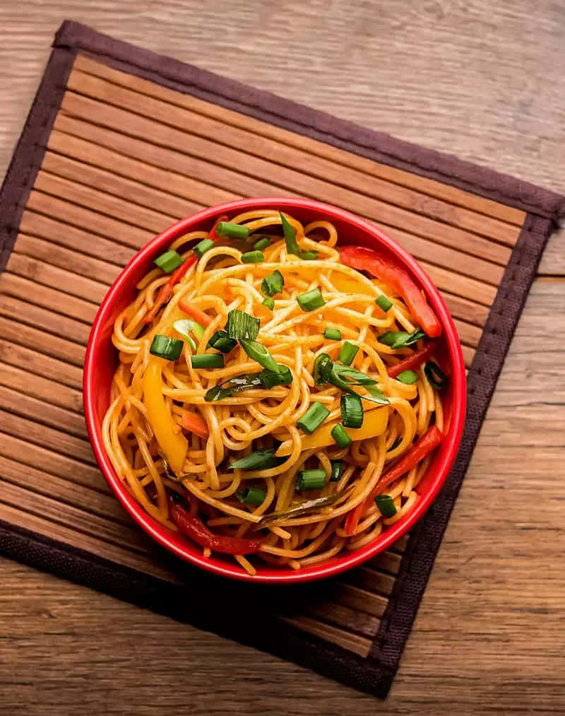 Hakka Noodles With Spring Onions Background