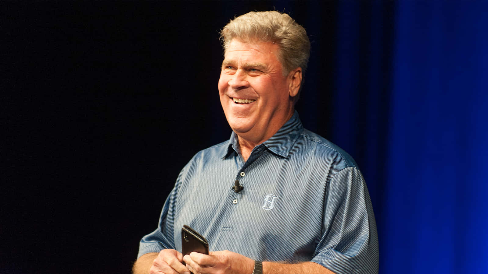 Hal Sutton Holding A Phone