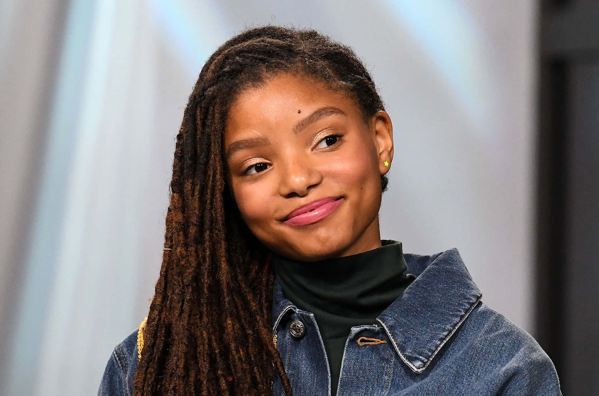 Halle Bailey Smiling Portrait Background