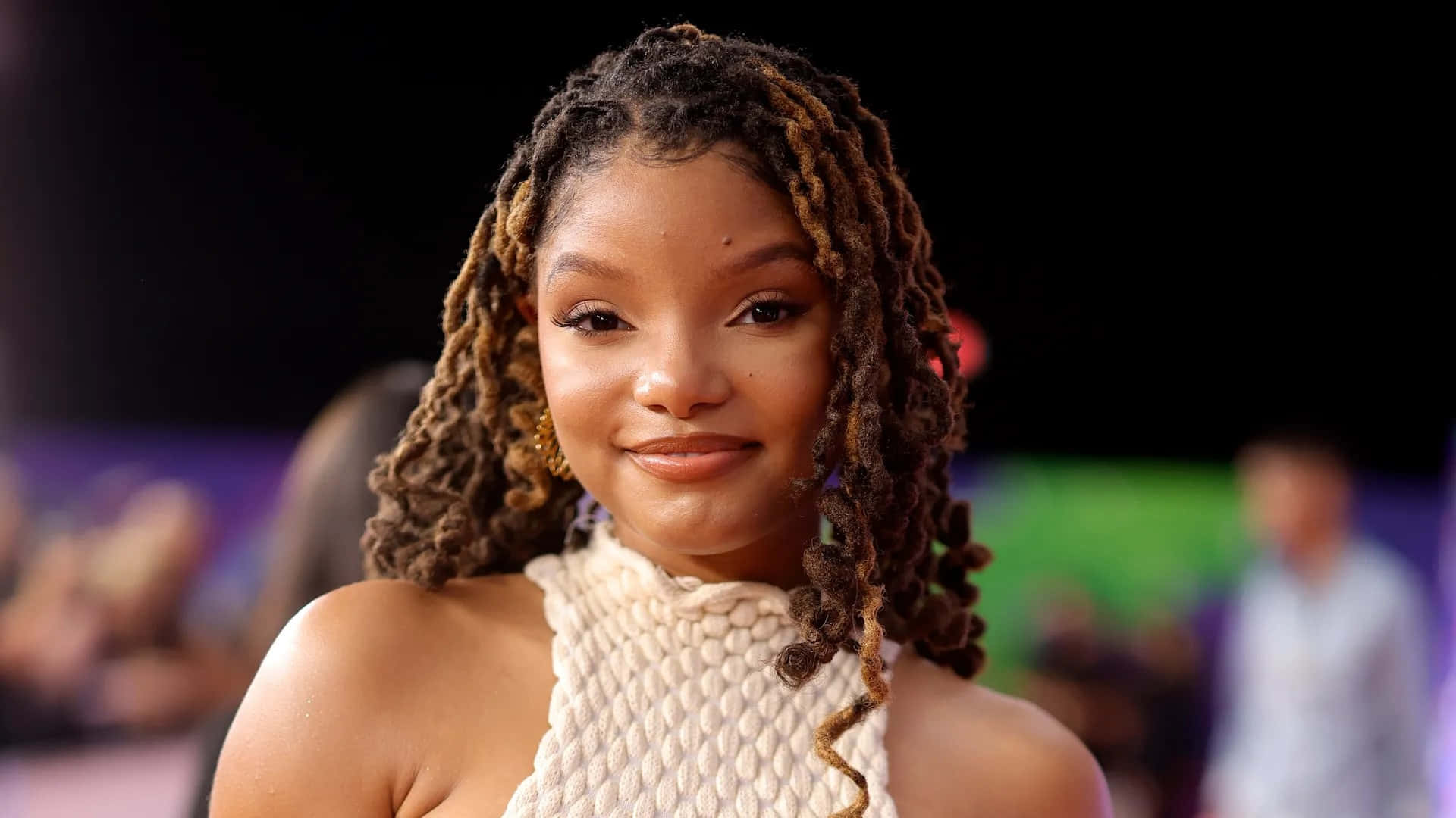 Halle Bailey Smilingat Event Background