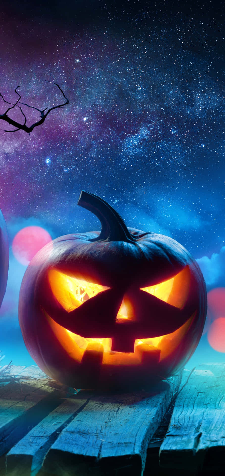 Halloween Pumpkin Glowing Under Starry Sky Background