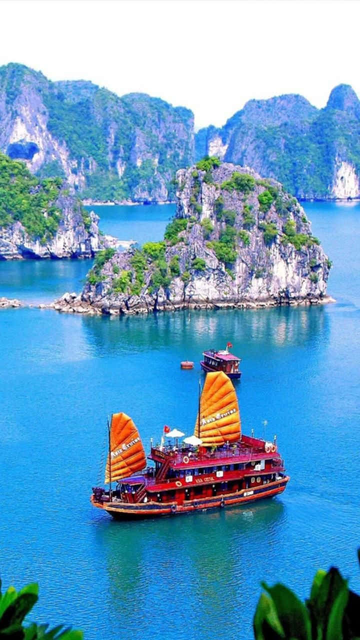Halong Bay With Red Cruise Ship Background