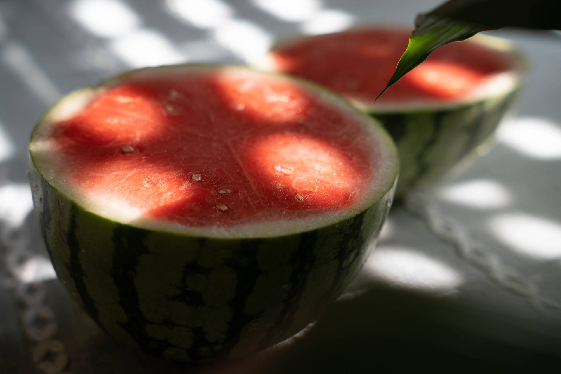 Halved Watermelon Under The Sun Background