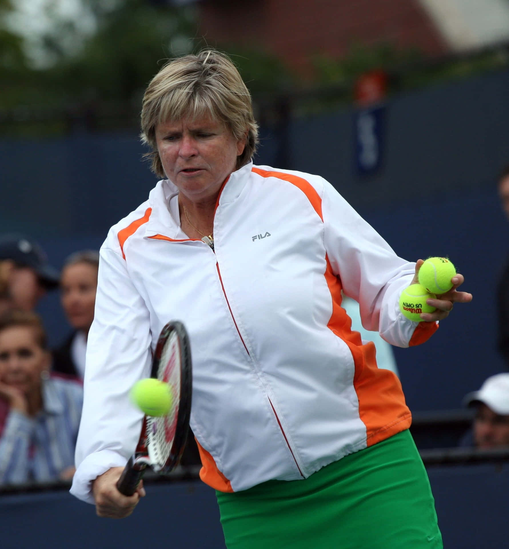 Hana Mandlikova Hitting A Ball With Her Racket Background