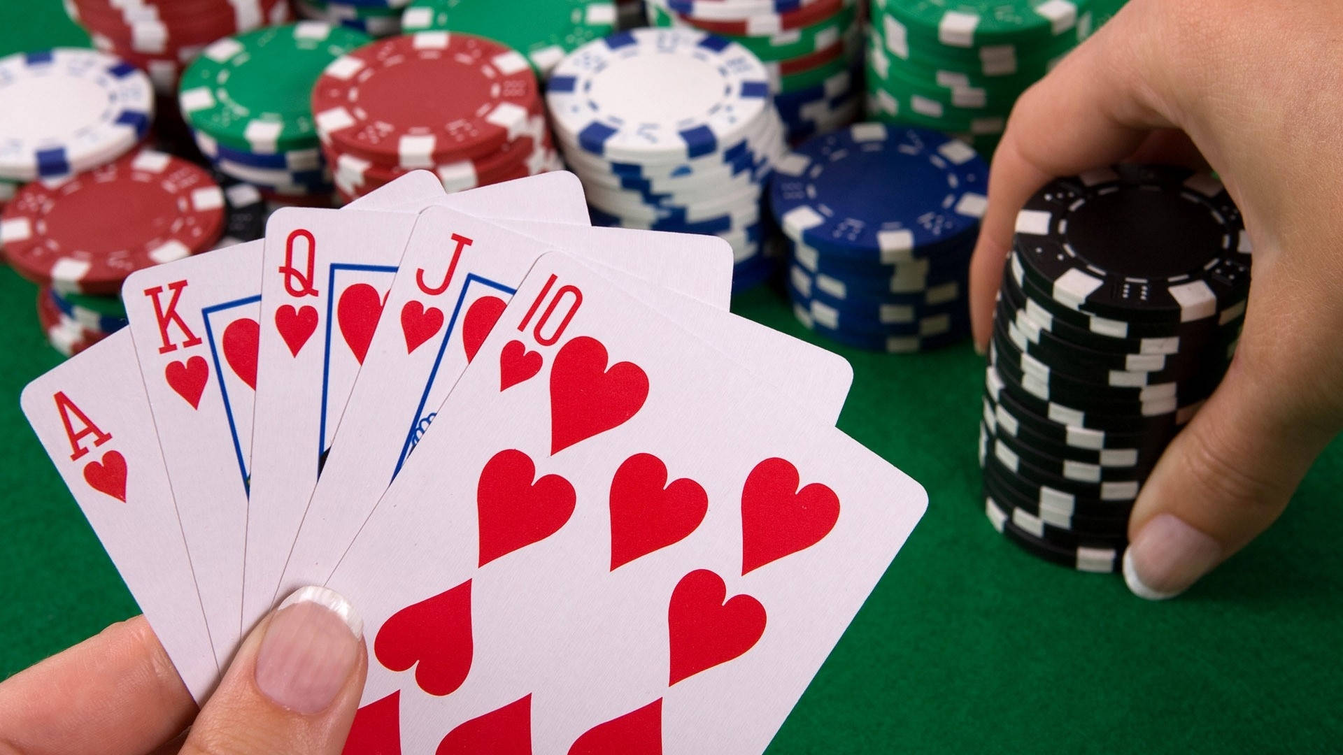 Hand Holding A Royal Flush Card Baccarat Game