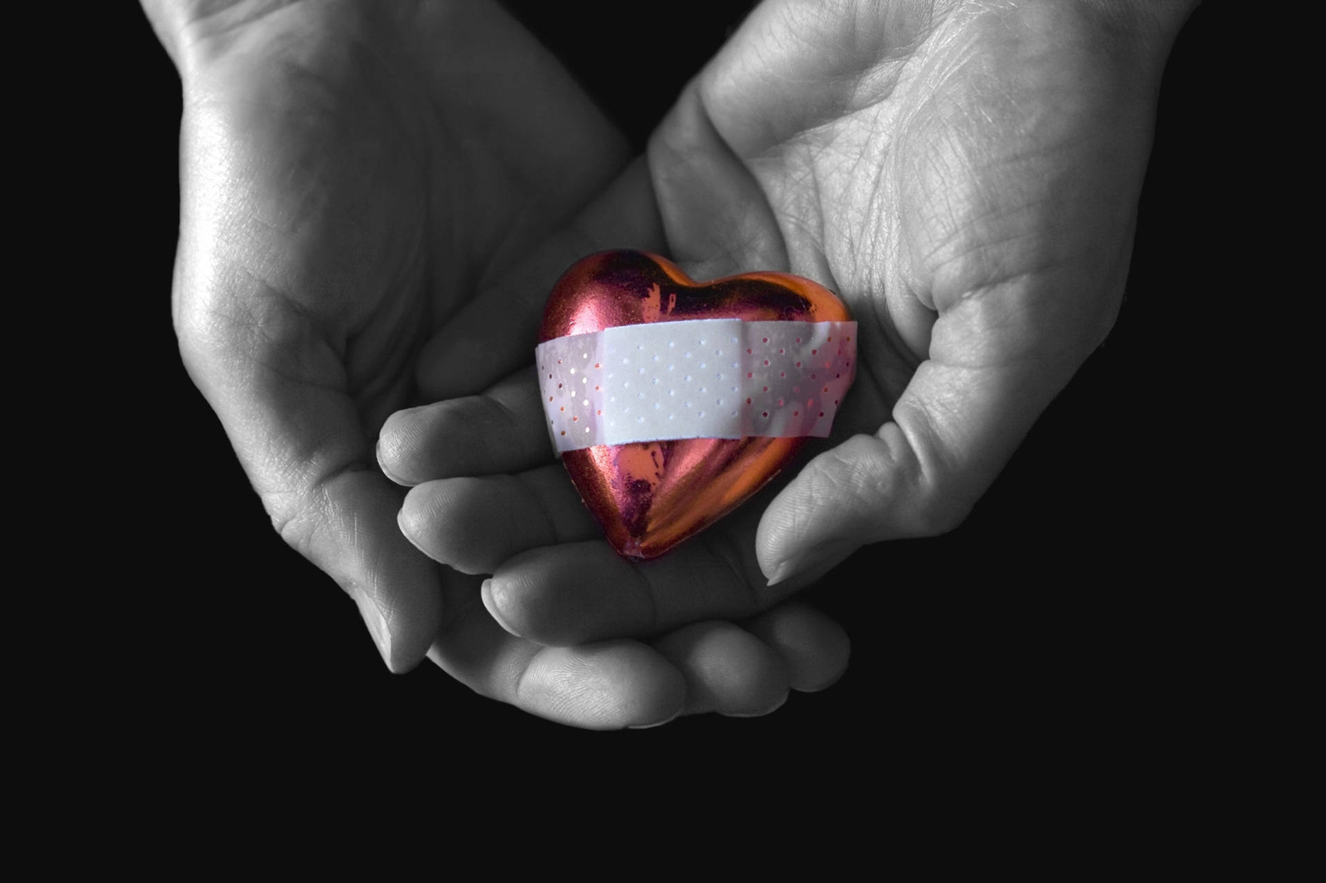 Hand Holding Bandaged Broken Heart 4k Background