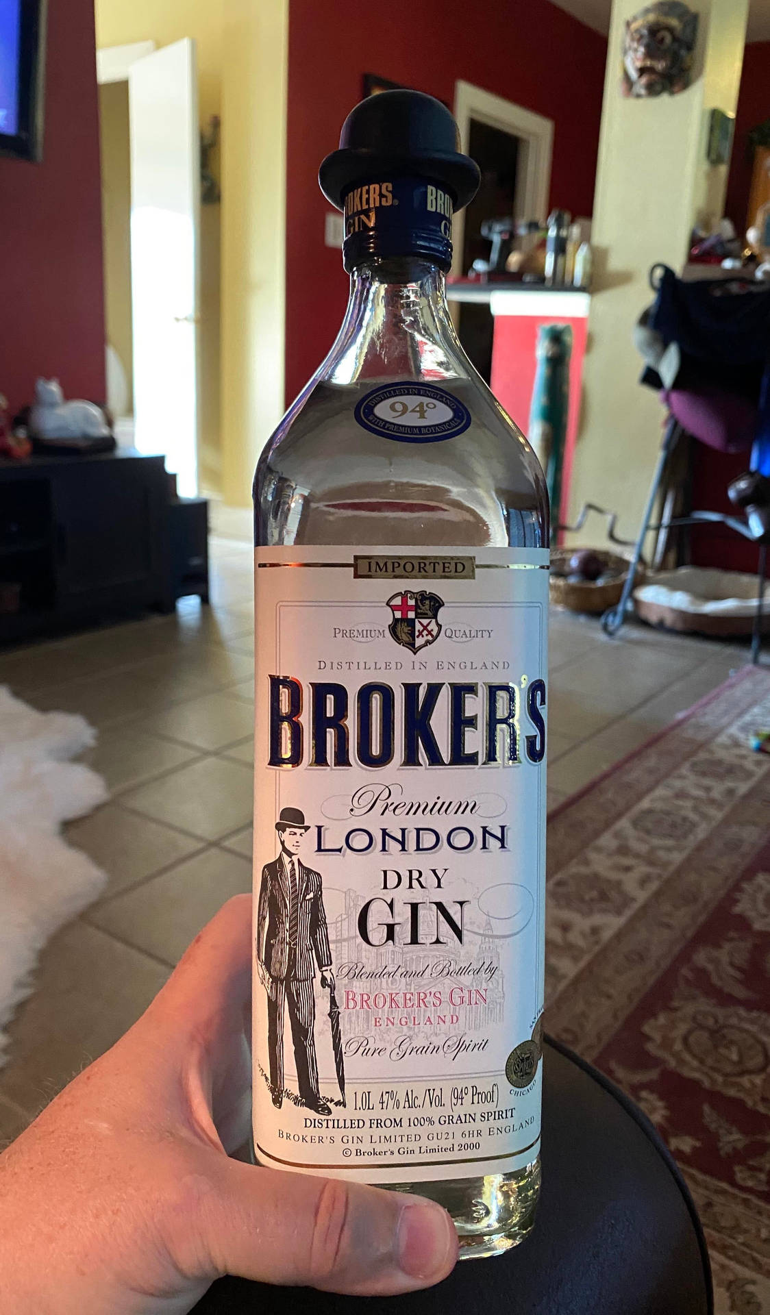 Hand Holding Brokers Gin Background