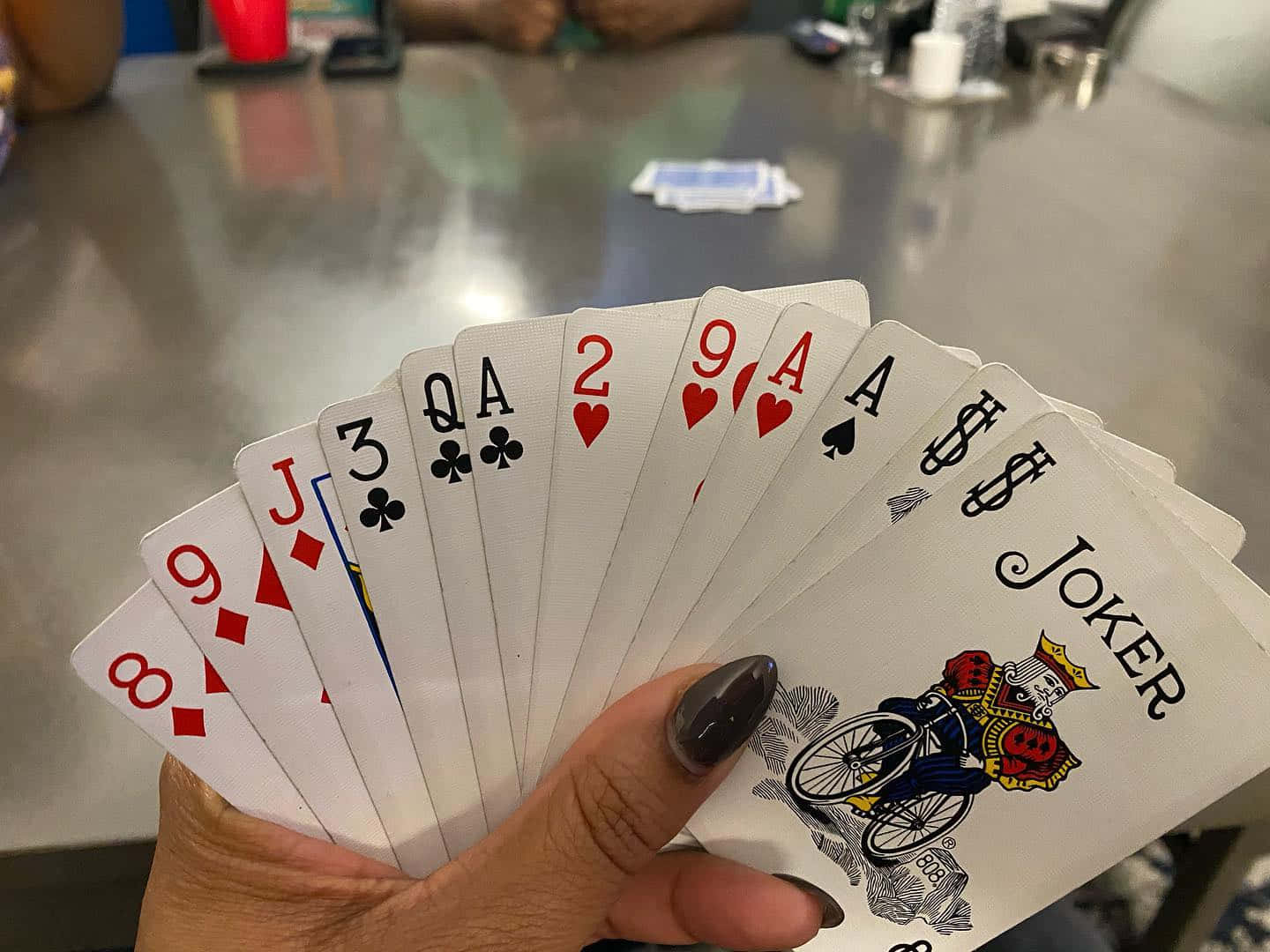 Hand Holding Playing Cards