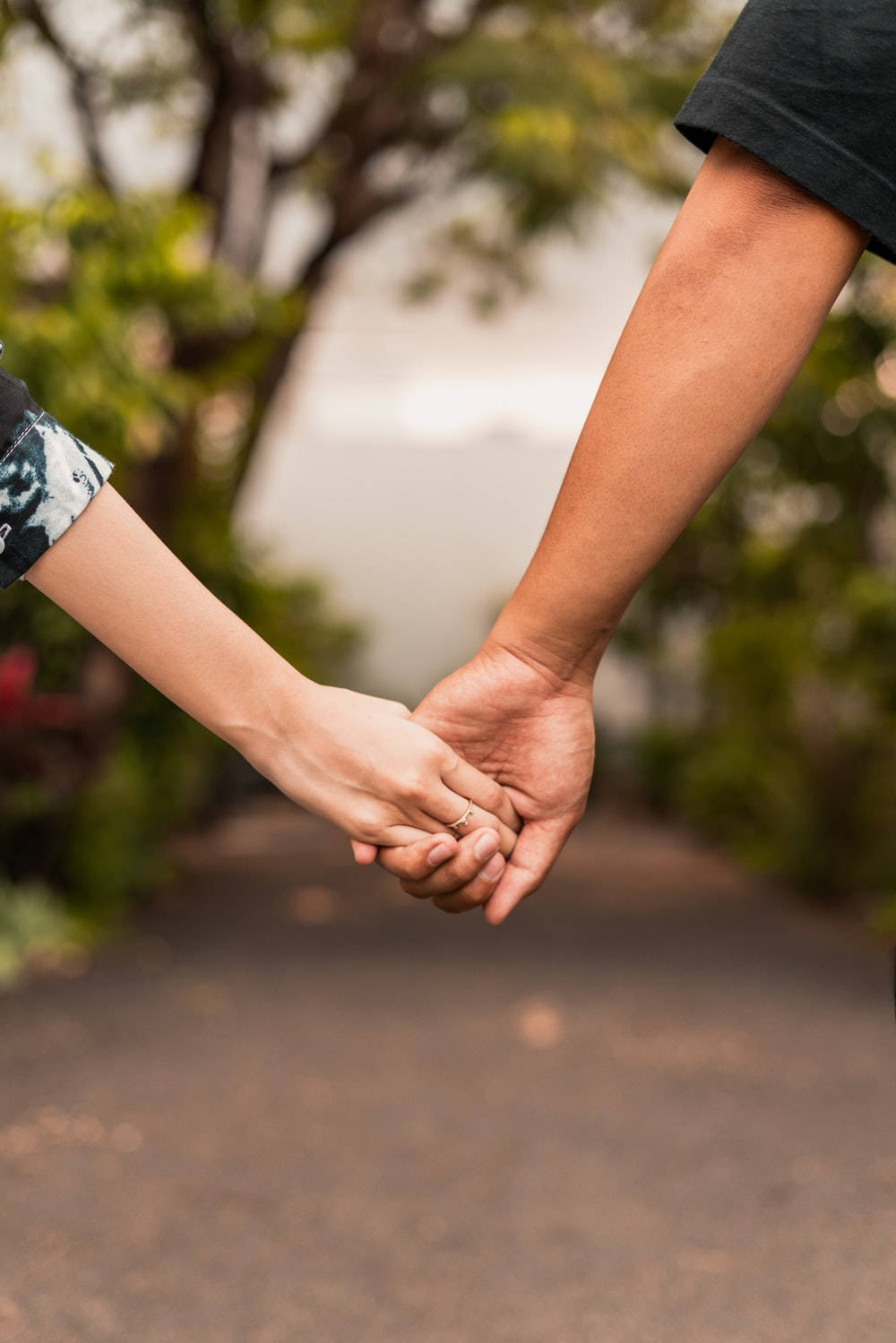 Hand In Hand Couple In Pathway Background