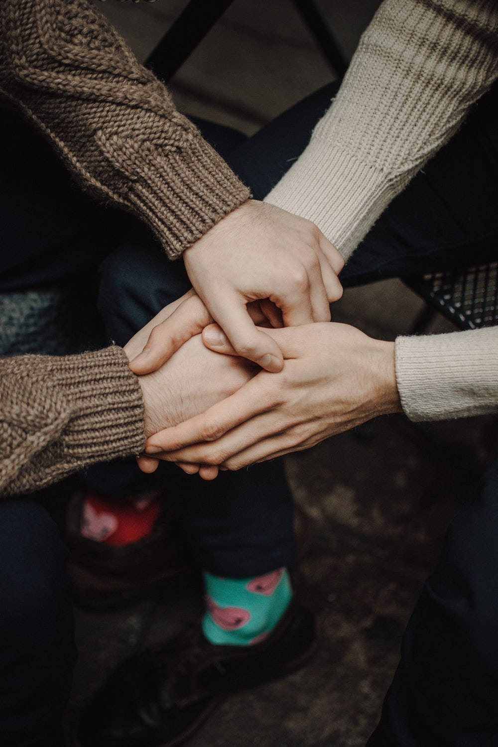 Hand In Hand Couple In Sweater Background