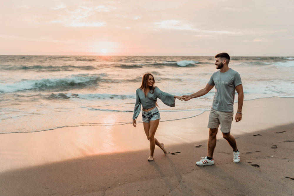 Hand In Hand Couple On Beach Background