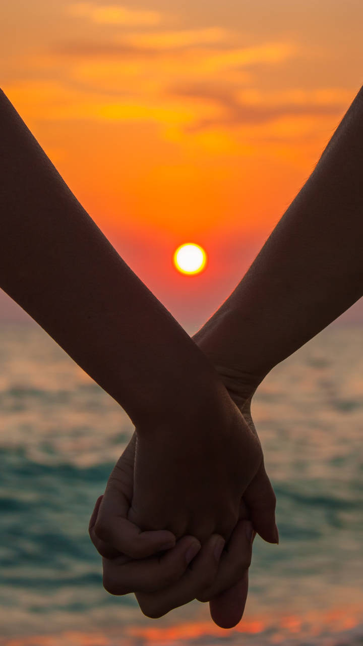 Hand In Hand Sunset Background