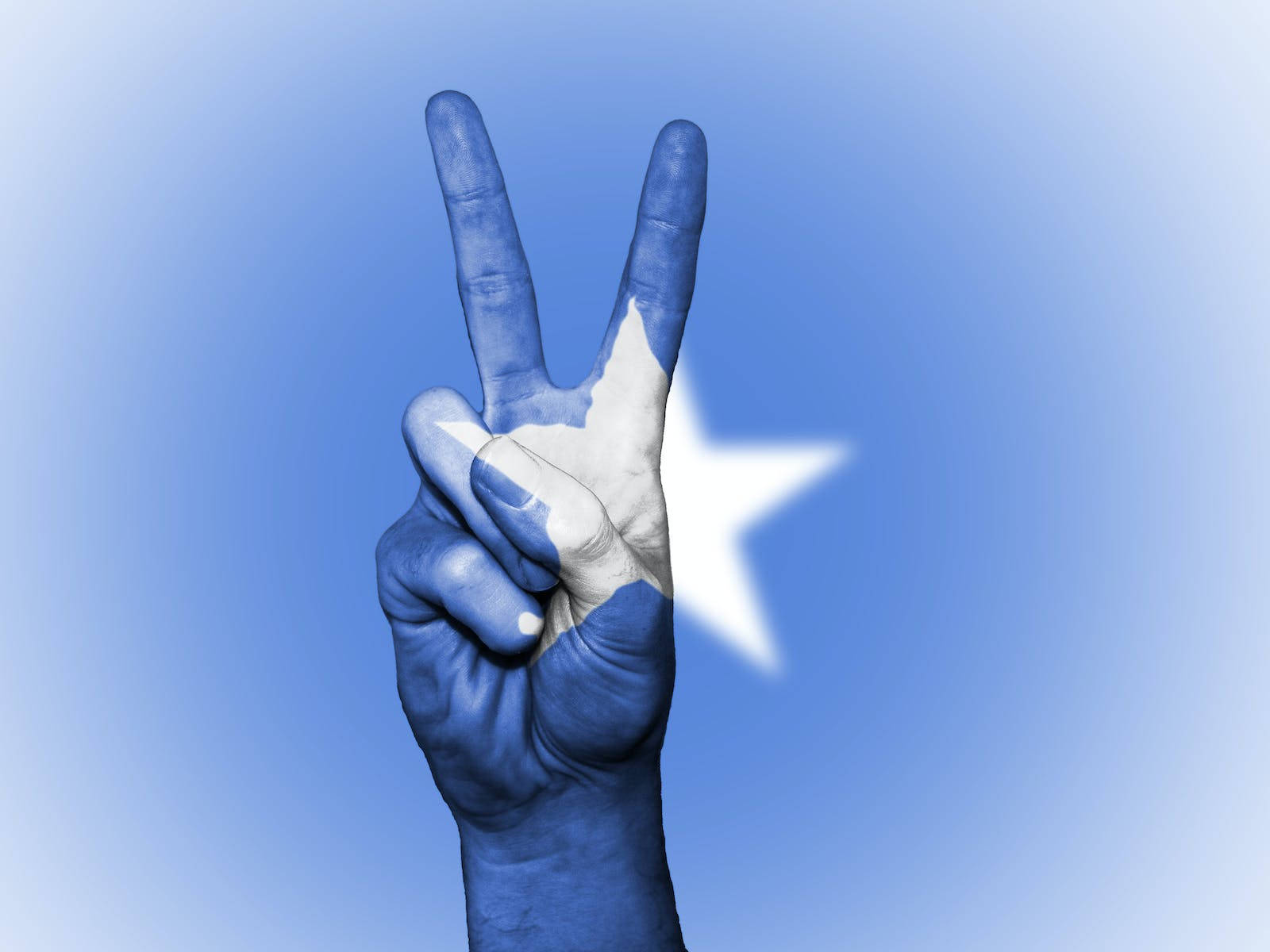 Hand Peace Symbol On Somalian Flag Background