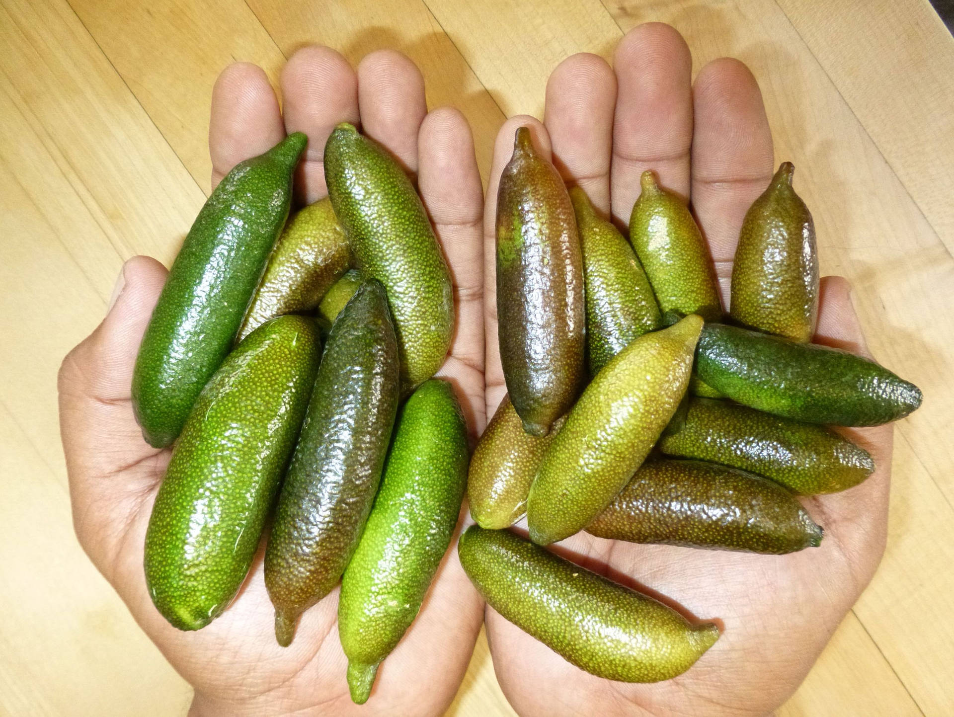 Handfuls Of Finger Limes Background