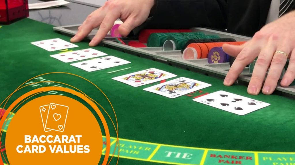 Hands Examining The Cards Laid Out In A Baccarat Background