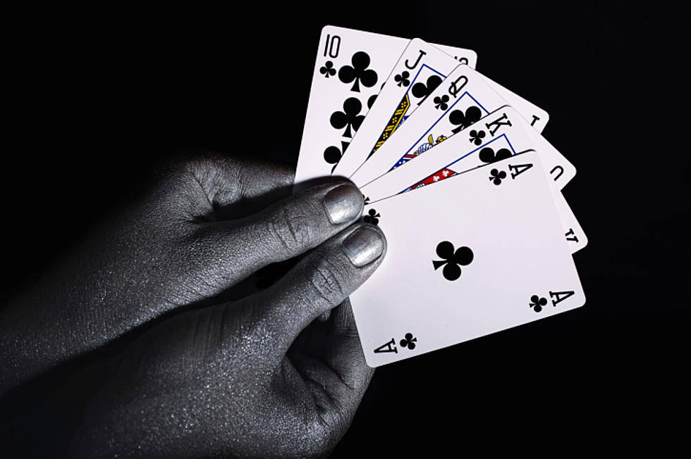 Hands Holding Euchre Playing Cards