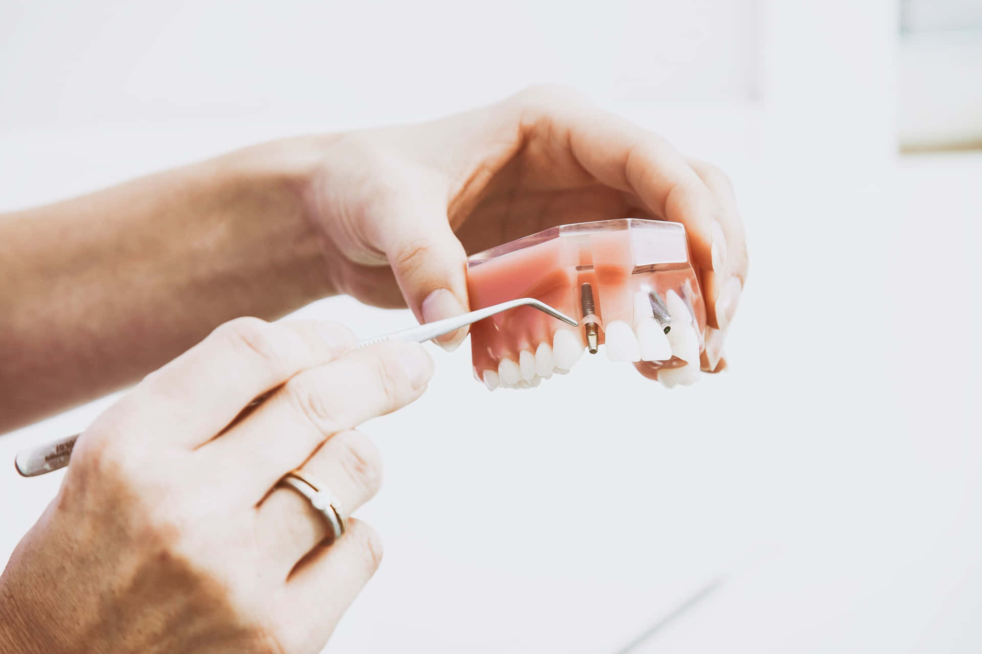 Hands Holding Oral Mouthpiece Background