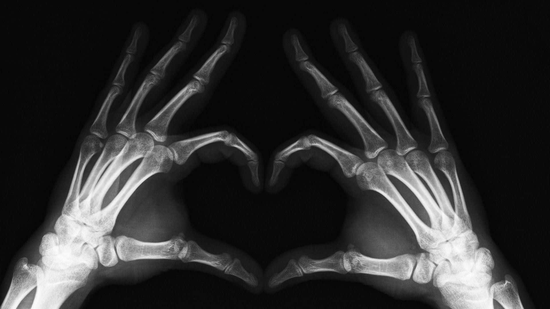Hands Making A Heart Shape In Black And White Photo