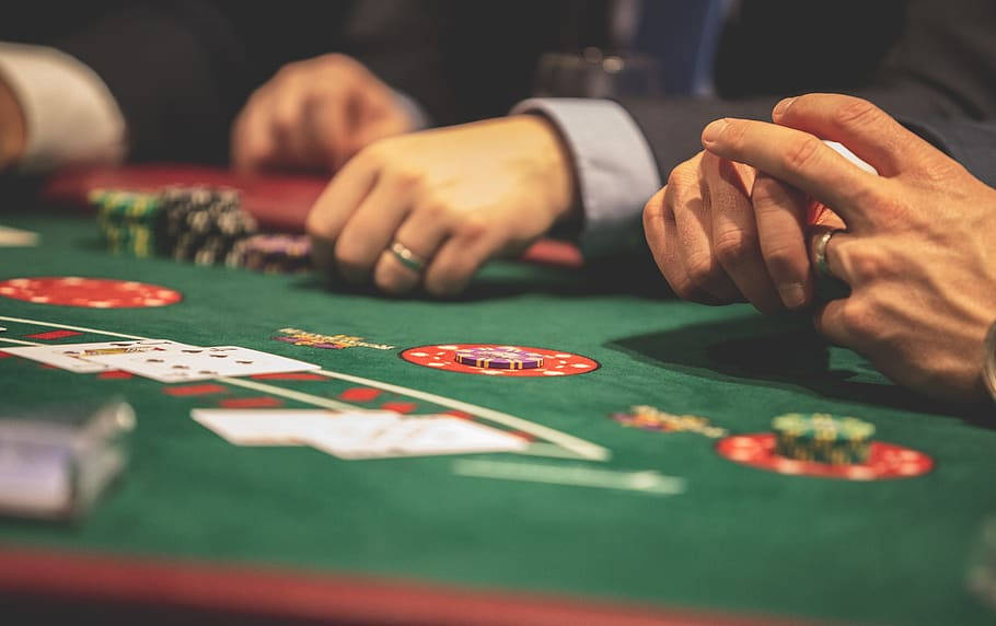 Hands Of Men Wearing Suit Playing Baccarat Background