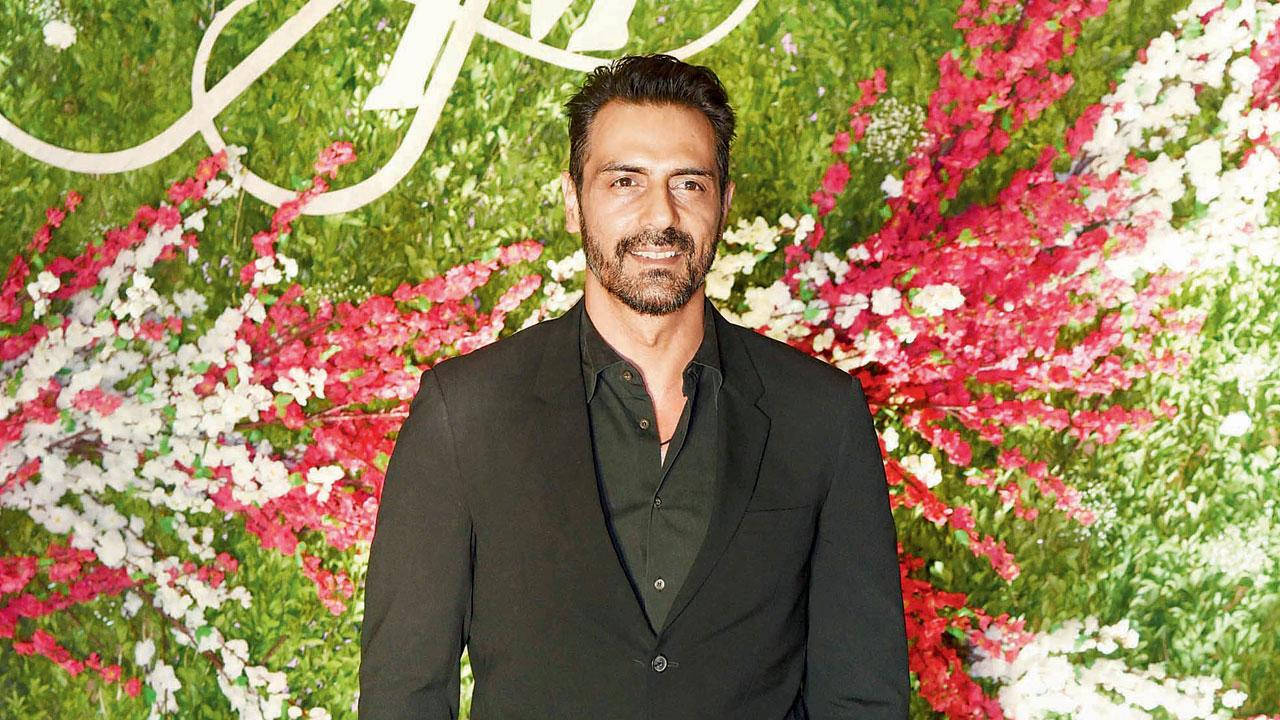 Handsome Arjun Rampal With Floral Background Background