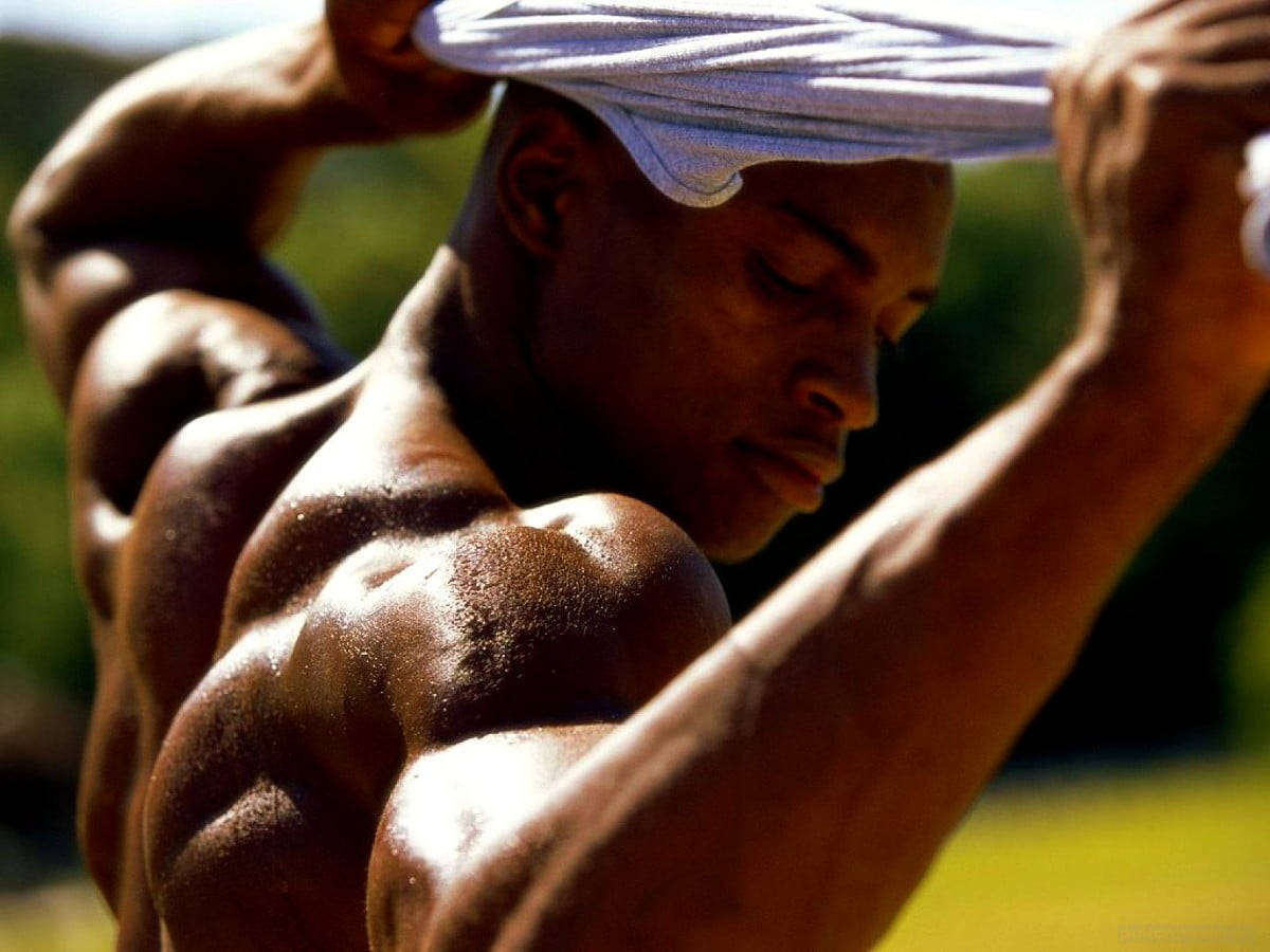 Handsome Black Man Removing Shirt Background