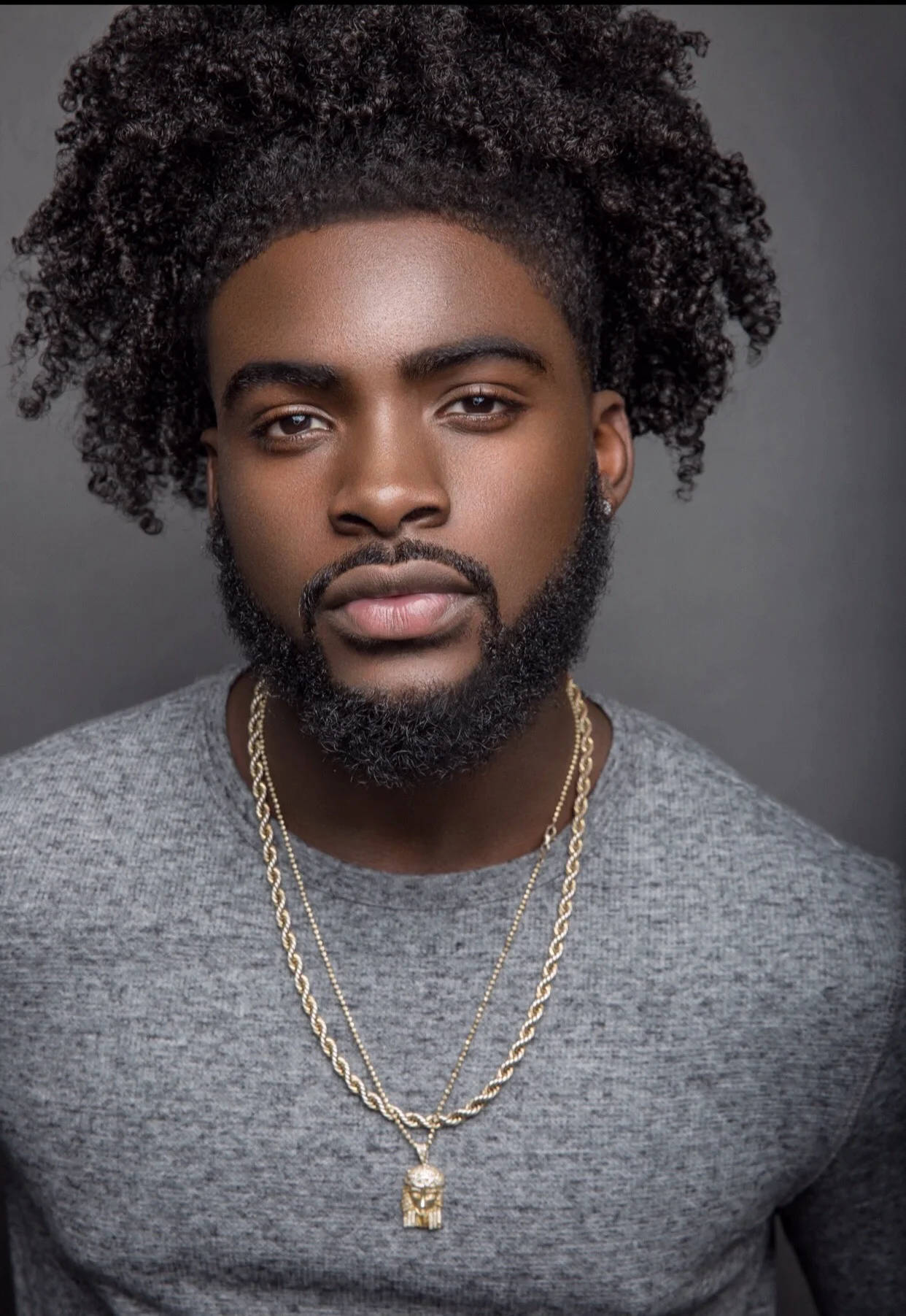 Handsome Black Man With Gold Necklaces Background