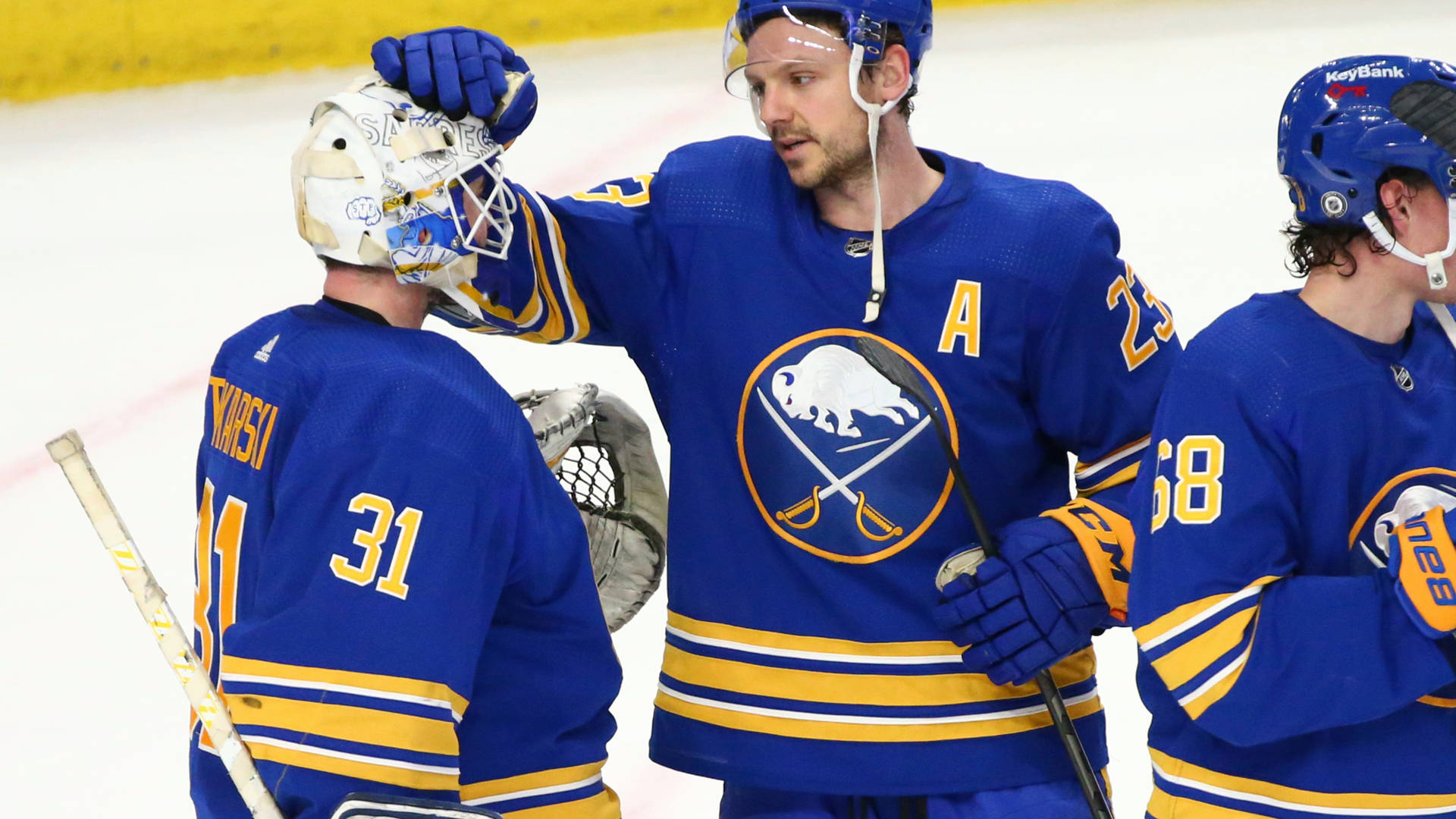 Handsome Canadian Ice Hockey Player Sam Reinhart With Teammates Background