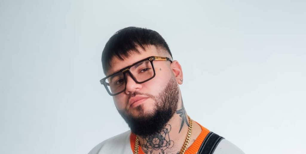 Handsome Farruko With Iconic Glasses Background