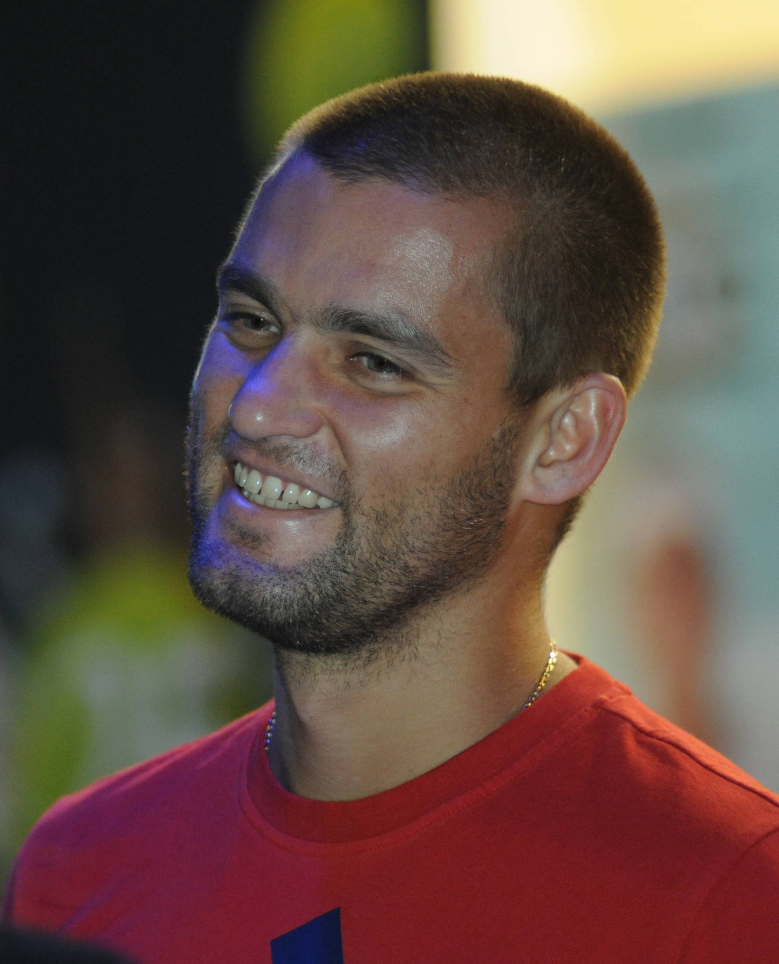 Handsome Smile From Mikhail Youzhny Background