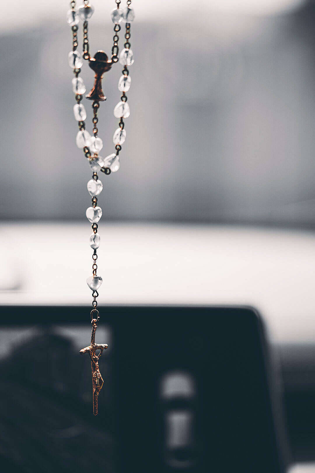 Hanging Rosary With Jesus On Cross Background