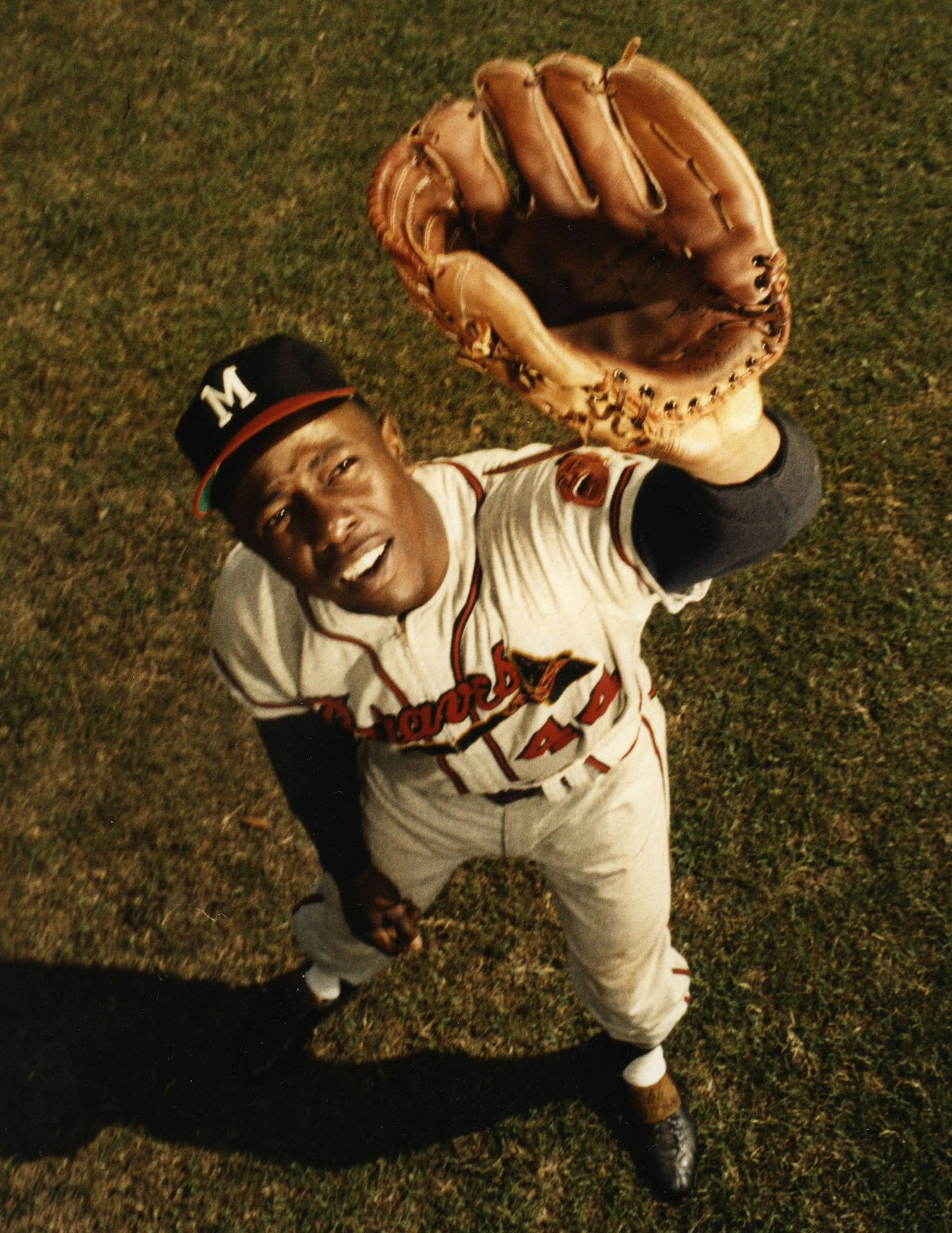 Hank Aaron Covering Eyes With Glove Background