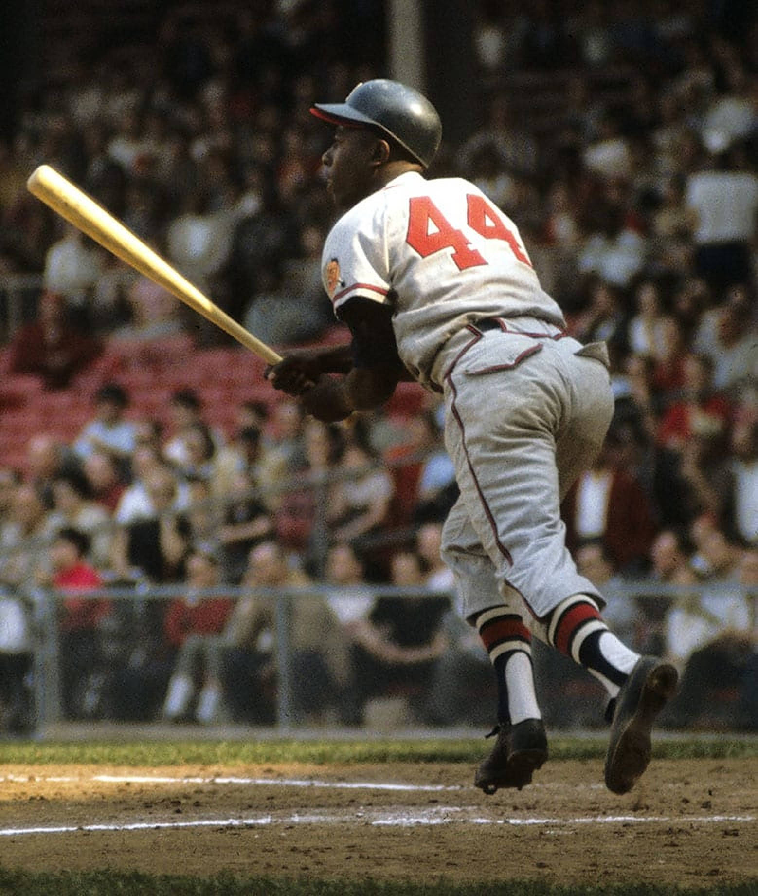 Hank Aaron Leaping From Base Background