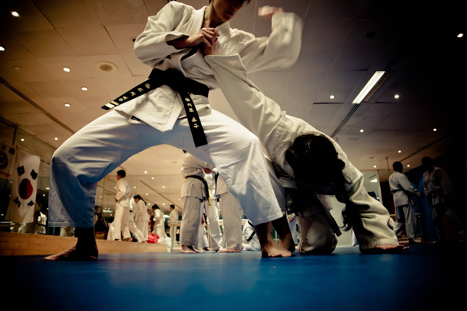 Hapkido Master Demonstrating A Wrist-lock Technique In Class