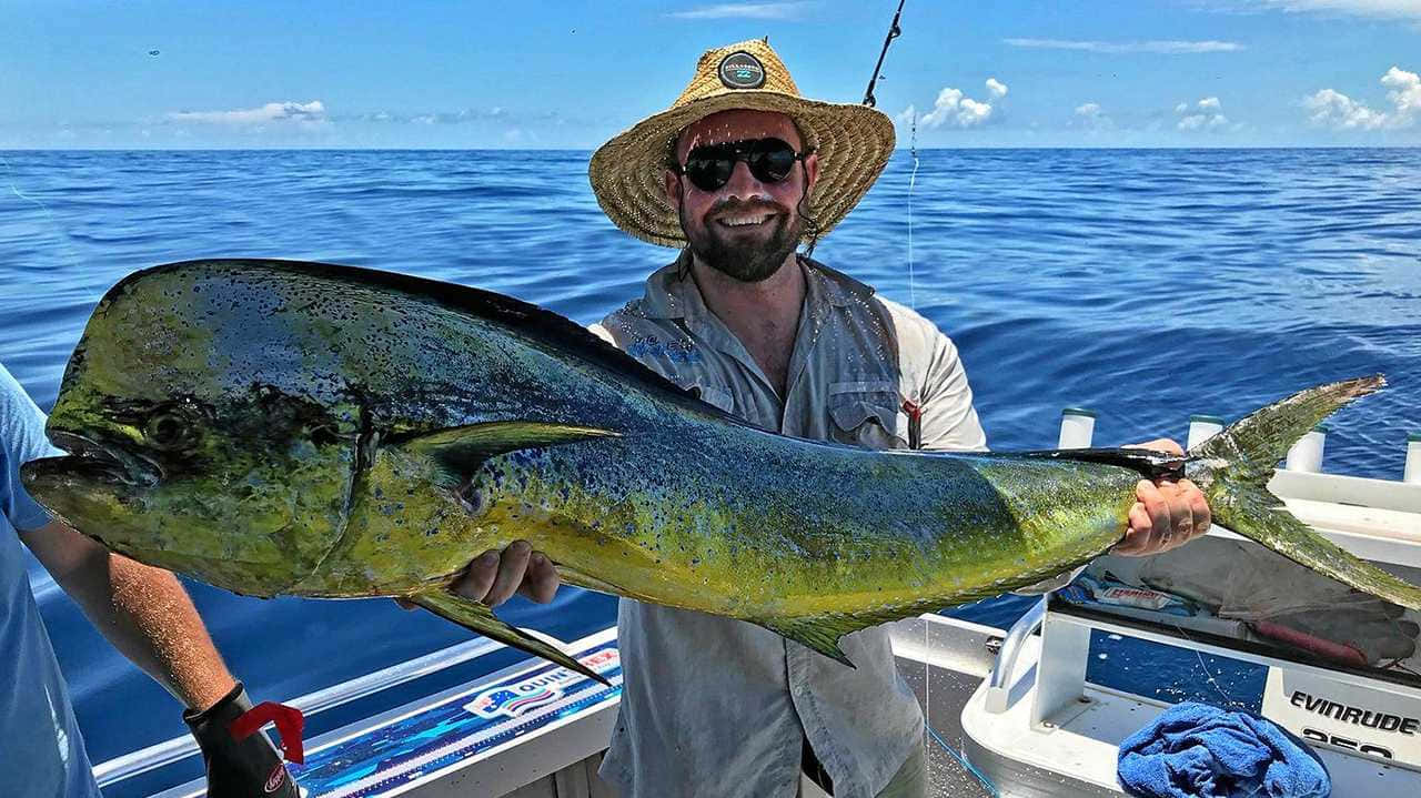 Happy Anglerwith Caught Mahi Mahi Background