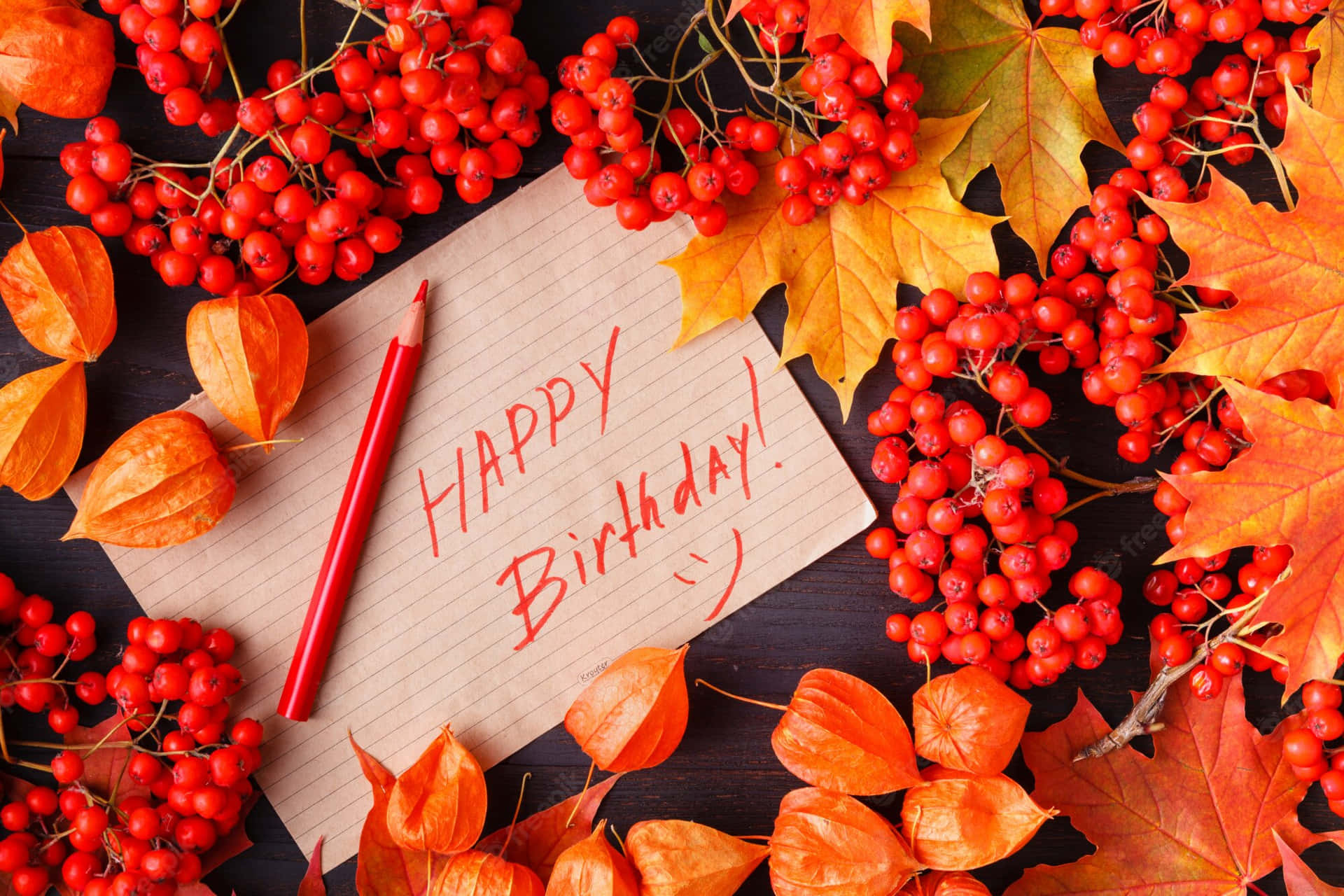 Happy Birthday Card With Red Berries And A Red Pen Background