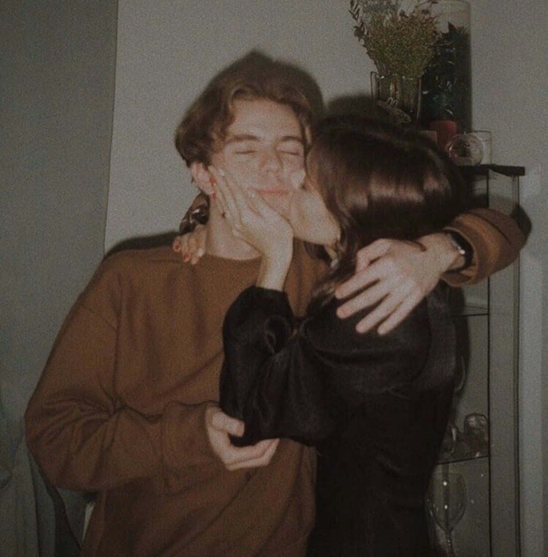 Happy Couple Enjoying A Cozy Embrace Background