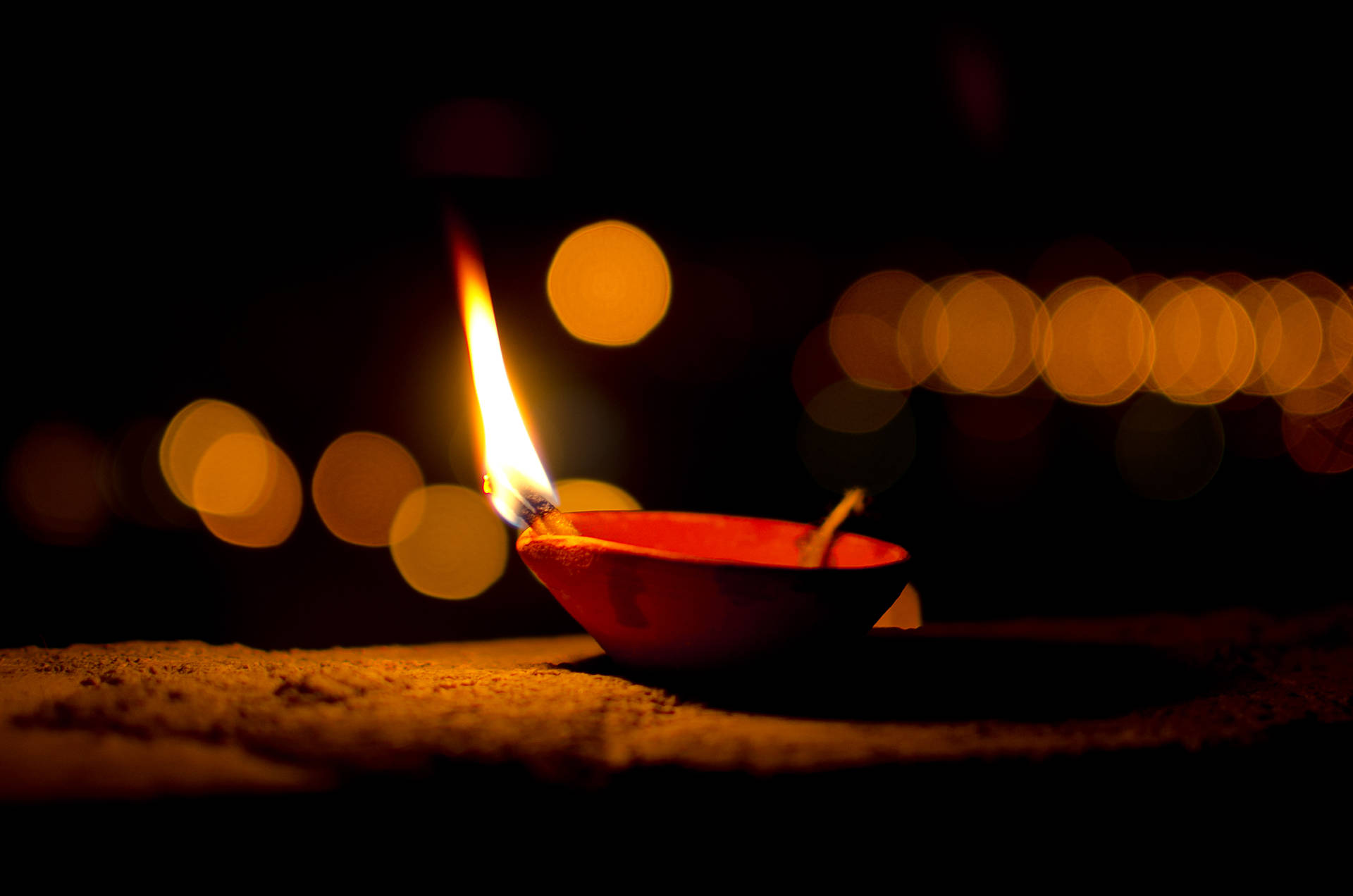 Happy Diwali Light On Red Bowl Background