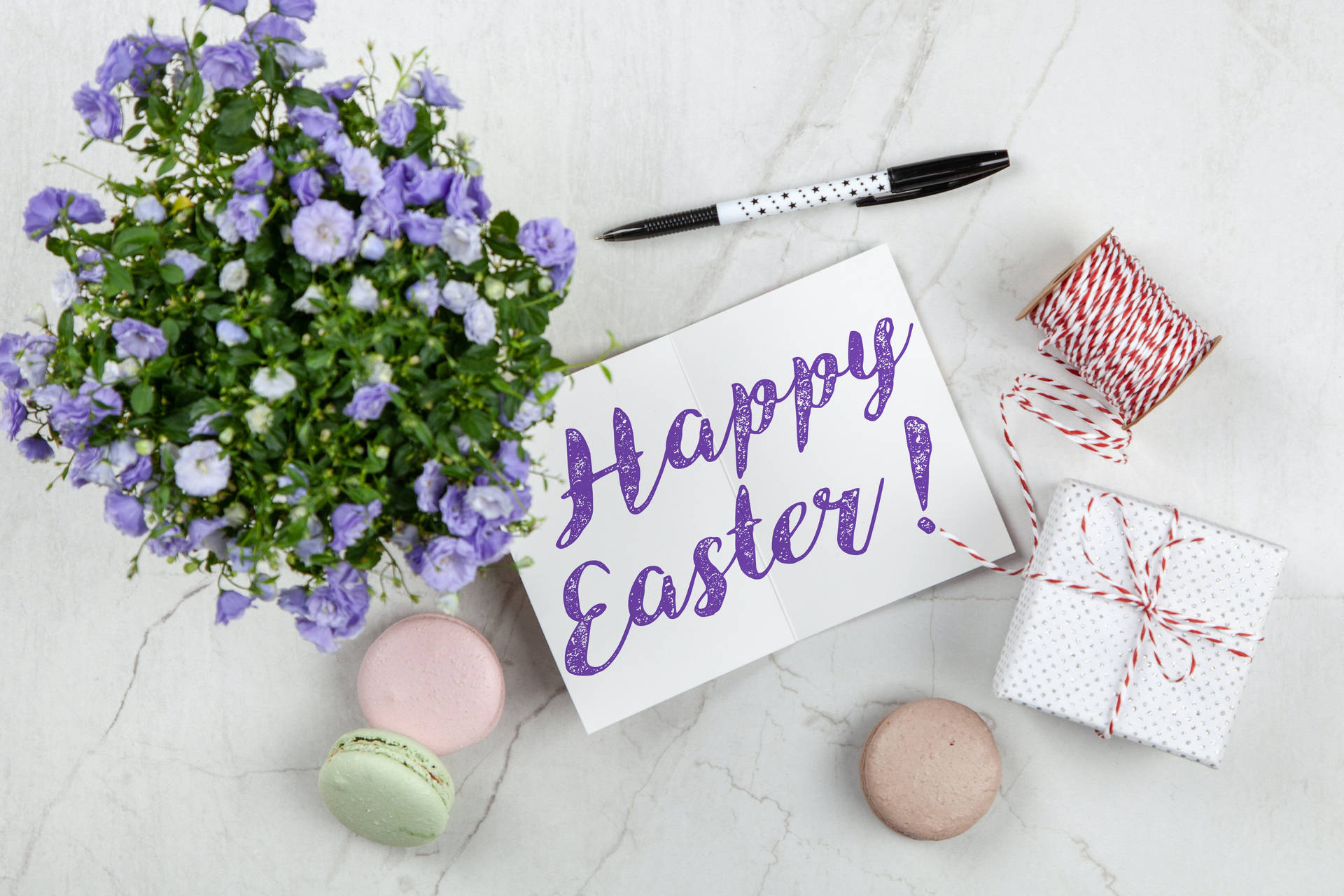 Happy Easter Flat Lay Violet Calligraphy With Bellflowers Background